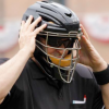 Umpire helmet adjusted by MLB Umpire on field