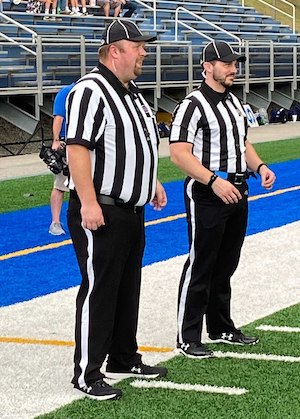 2 Officials in Football Referee Uniforms