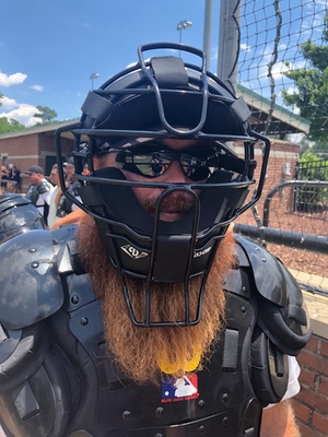 Umpire Wearing Mask with Long Beard