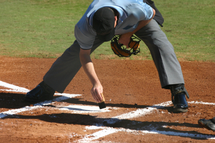 Umpire Brushing Off Home Plate